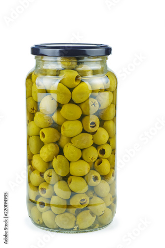 Glass jar with pitted green olives