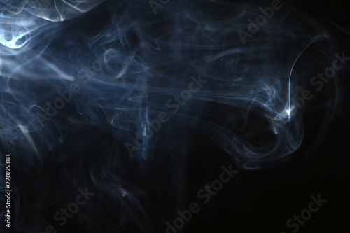 amazing swirl contrast bright smoke on heavy black background.