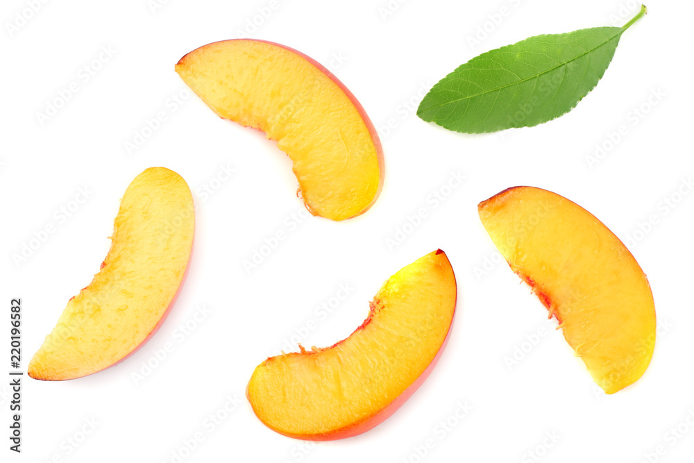 peach fruit with green leaf and slices isolated on white background. top view peach fruit with green leaf and slices isolated on white background. top view
