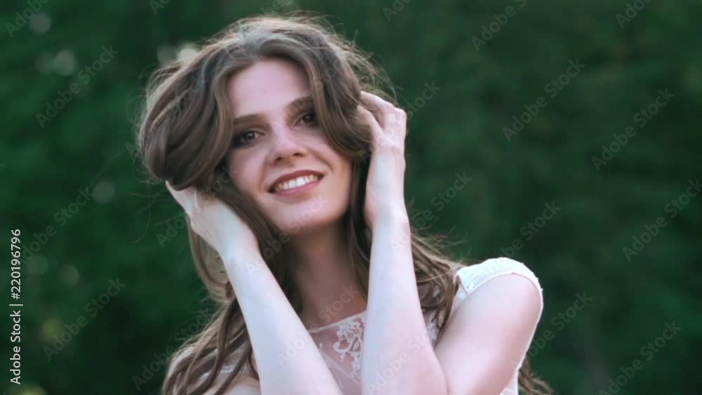 Portrait of a beautiful girl in the nature in slow motion. Portrait of a beautiful girl in the nature in slow motion.