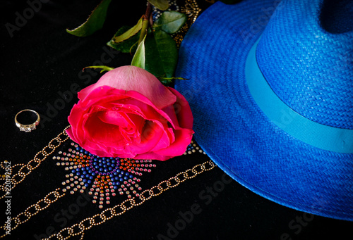 Pink rose, blue hat, diamond ring