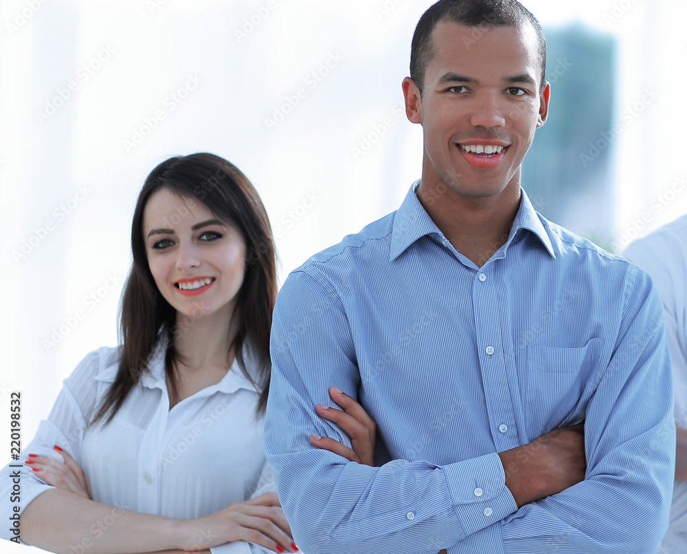 portrait of a successful group of business people on the background of the office. portrait of a successful group of business people on the background of the office.