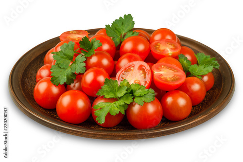 Fresh tomatoes on plate. Isolated on white background.