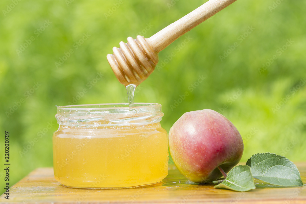 Honey jar, stick and apple Honey jar, stick and apple