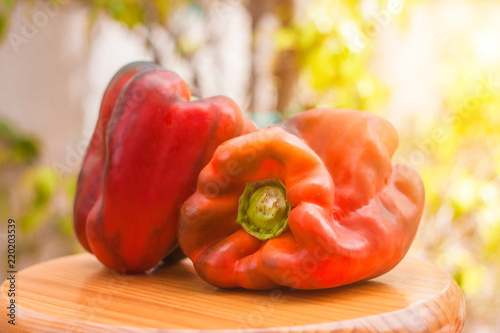 A huge ripe pepper on the board