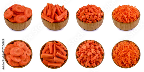 Sliced and shredded carrots in bamboo bowls isolated on white background. Top views and perspective views. photo