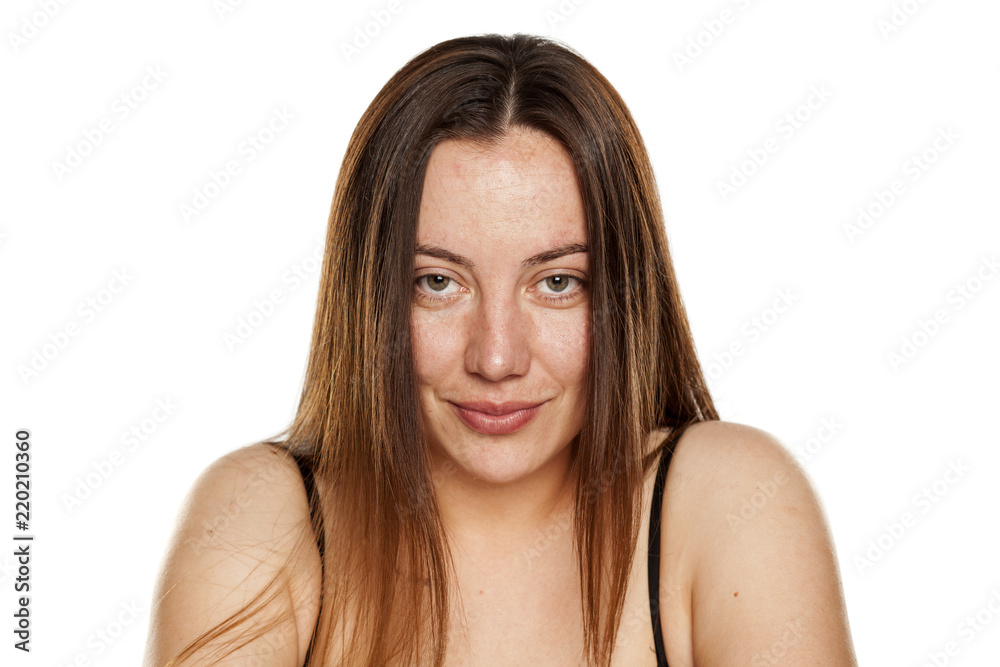beautiful middle-aged smiling woman without makeup on white background beautiful middle-aged smiling woman without makeup on white background