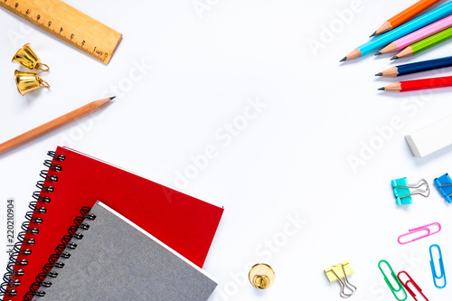 School and office supplies on a white table background, Top view.