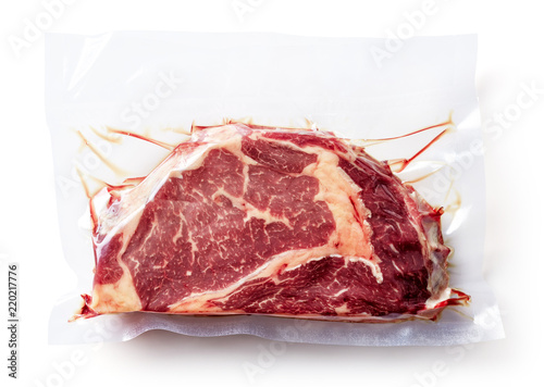Beef steak vacuum sealed isolated on white, from above