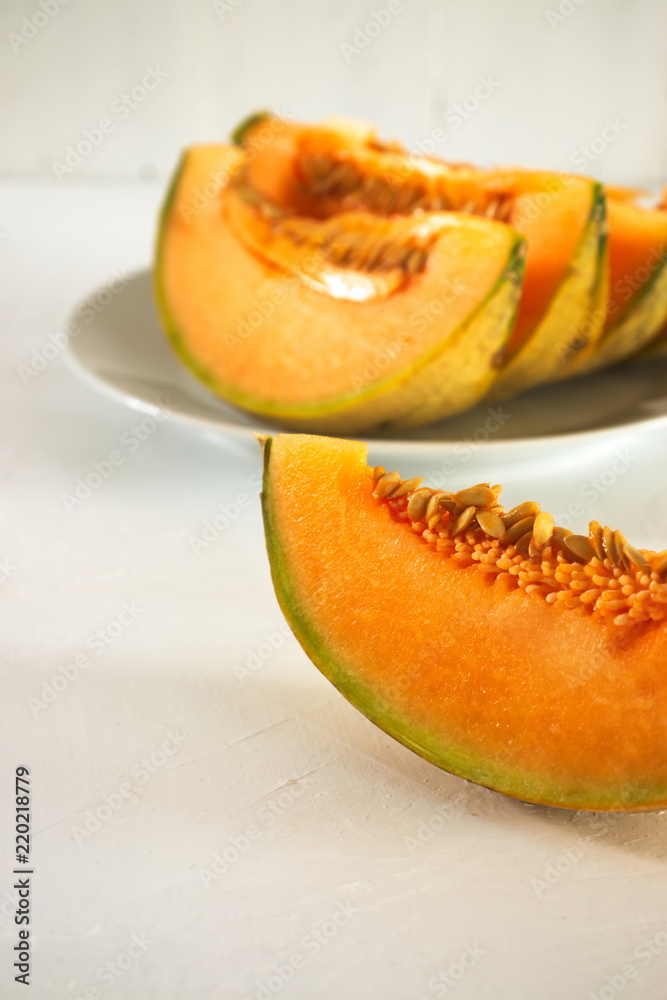 Freshly cut orange cantaloupe melon, with copy space