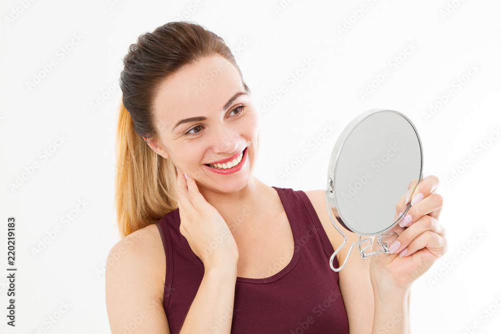 Young caucasian woman looking wrinkles on face in mirror isolated on white background. Skin care and makeup concept. Copy space Young caucasian woman looking wrinkles on face in mirror isolated on white background. Skin care and makeup concept. Copy space