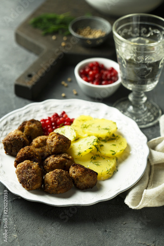 Meatballs with potato and red berries
