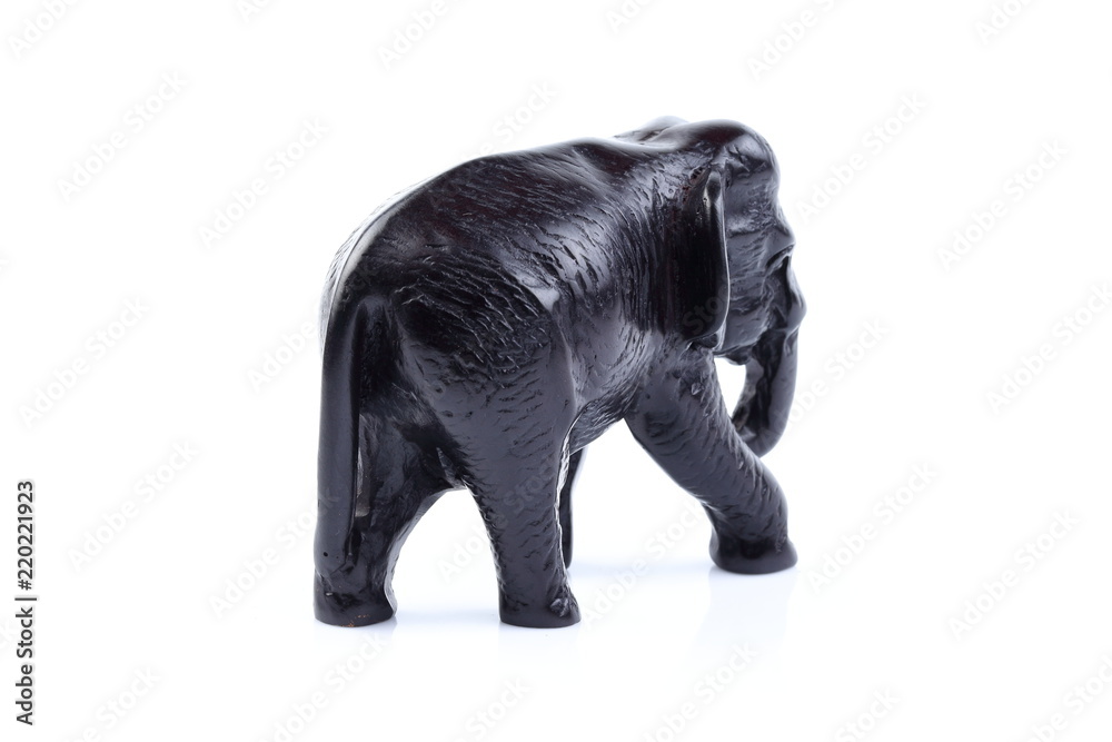 Black elephant like wooden carving with white ivory. Stand on white background, Isolated, Art Model Thai Crafts, For decoration Like in the spa. Black elephant like wooden carving with white ivory. Stand on white background, Isolated, Art Model Thai Crafts, For decoration Like in the spa.