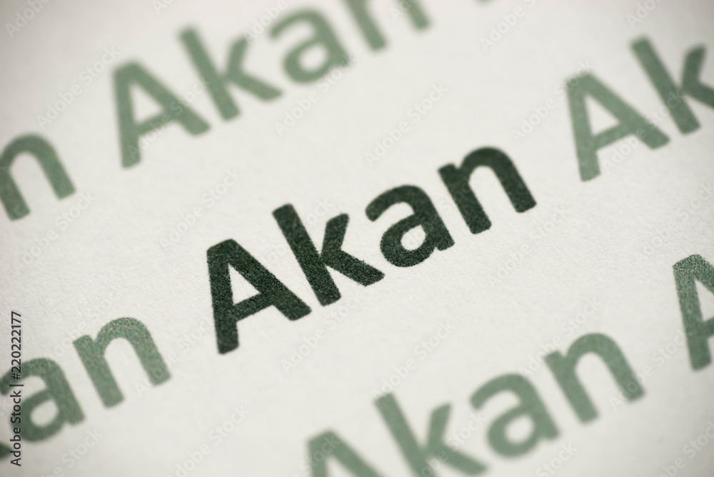 word Akan language printed on paper macro word Akan language printed on paper macro