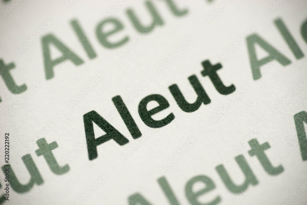 word Aleut language printed on paper macro word Aleut language printed on paper macro