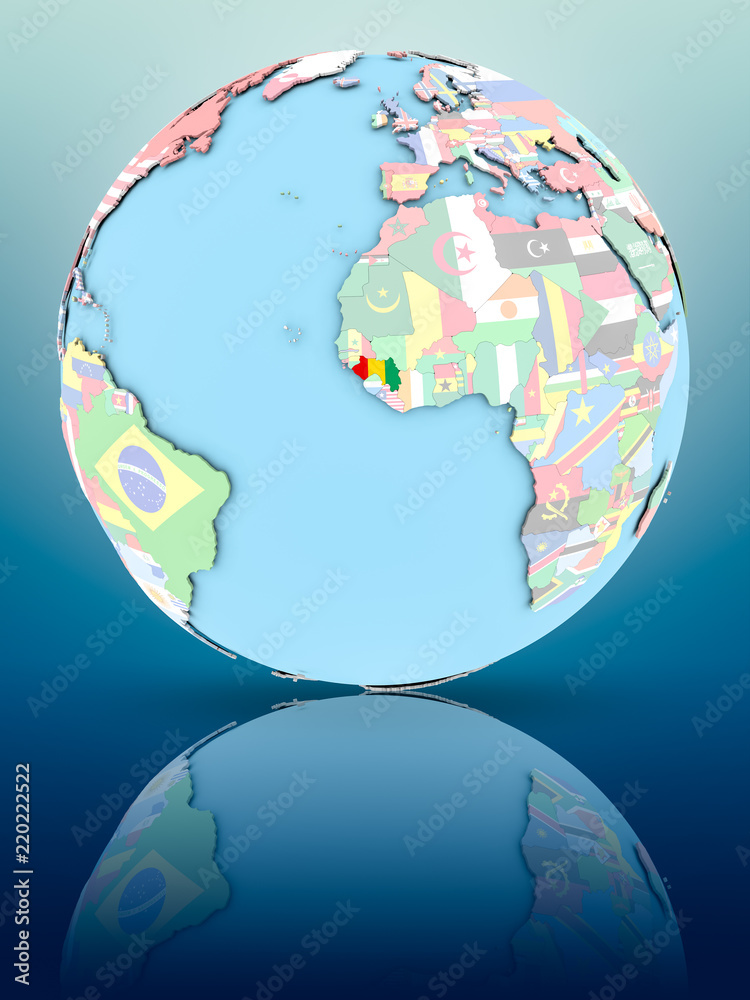 Obraz premium Guinea on political globe with flags