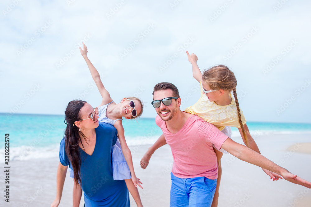 Happy beautiful family on the beach Happy beautiful family on the beach