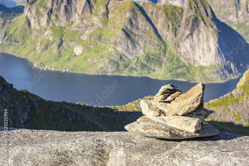 Rock cairn mark the route to Munkan mountain in Lofoten islands, Norway photo