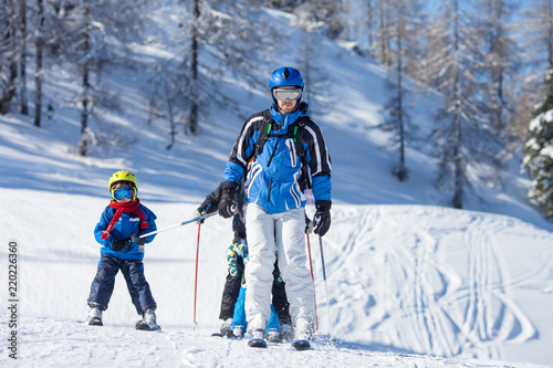 Young preschool child, skiing on snow slope in ski resort in Austria, wintertime 