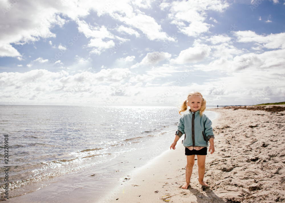 2 year old on the beach in Denmark - early fall