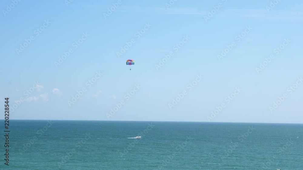 Two people parasailing over the sea. General view. Active vacation. Two people parasailing over the sea. General view. Active vacation.