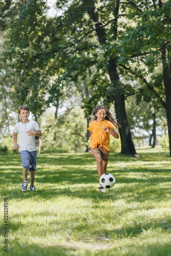cute happy kids playing with soccer ball in park © LIGHTFIELD STUDIOS