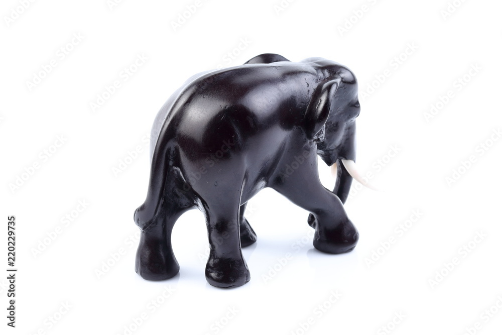 Black elephant like wooden carved with white ivory. Stand on white background, Isolated, Art Model Thai Crafts, For decoration Like in the spa. Black elephant like wooden carved with white ivory. Stand on white background, Isolated, Art Model Thai Crafts, For decoration Like in the spa.