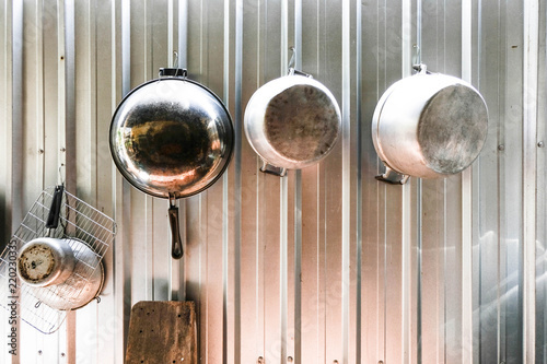 Pots and pans hung up in a Thai kitchen