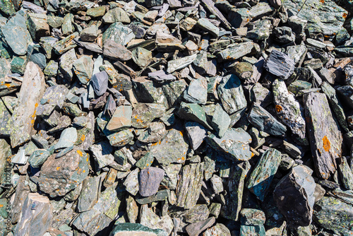 Wallpaper Mural Natural texture of mountain of friable boulders close up. Detailed background of gray stones with orange moss. Mountainside with copy space. Torontodigital.ca