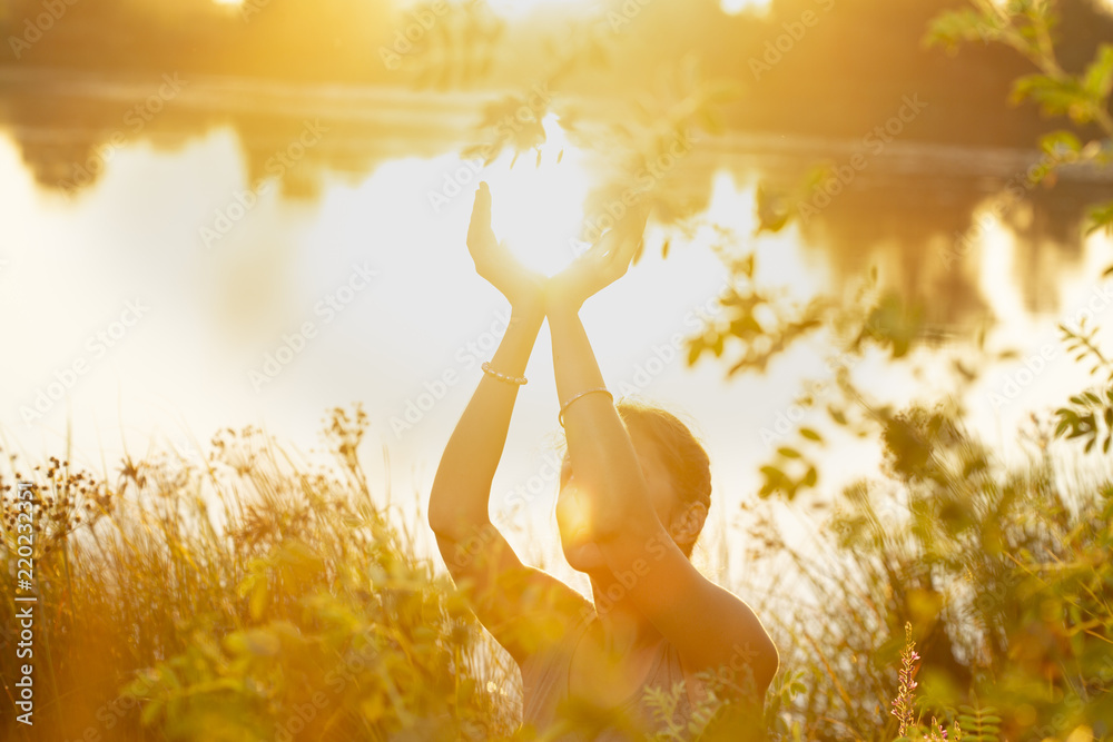 Ταπετσαρία woman hands in mudra like in the palm of hands, at sunset  on the lake in nature