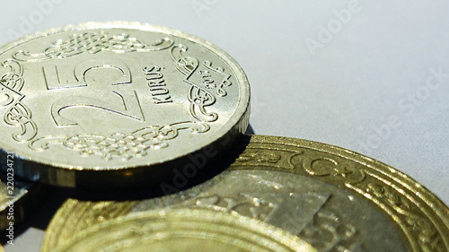 25 kurush coin with details on a Turkish 1 lira  coin with Turkish flag on a white background
