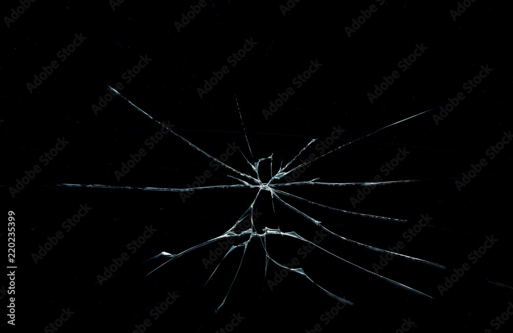 Obraz premium cracks on the glass on a black background