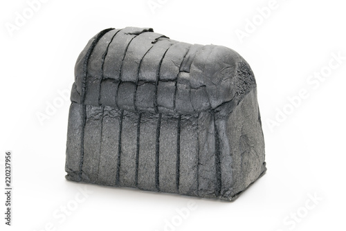 loaf slide of charcoal bread black bread isolated on white