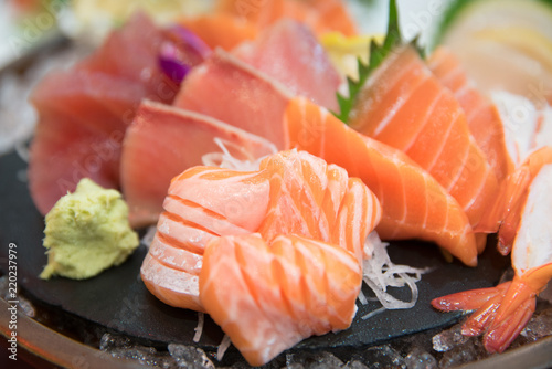 sashimi set with different fresh fish sliced on plate