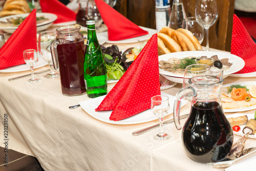 Enjoy a festive table in the restaurant with the red towels on the plates