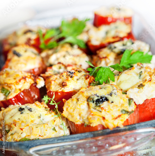 Stuffed pepper with chicken fillet, brown rice, vegetables and herbs. A dietary dish. photo