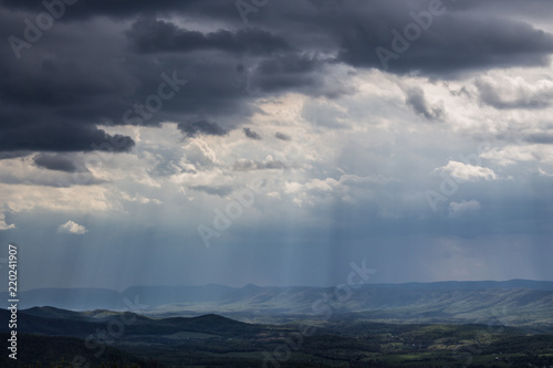 Shenandoah Valley National Park on a hazy summer day as the light breaks through the clouds casting shafts of light © Country Gate Prod.