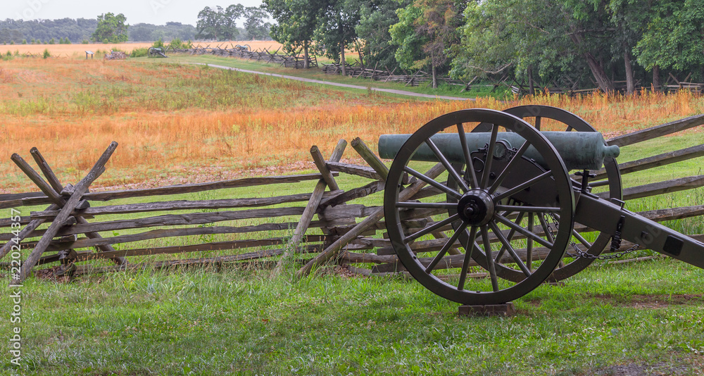 A single Cannon at Gettysburg PA by a split  log fence