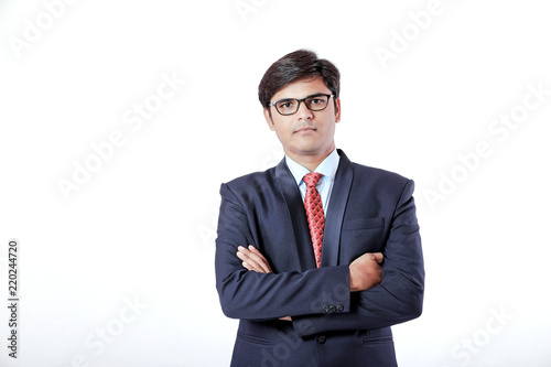 Young Indian businessman over white background