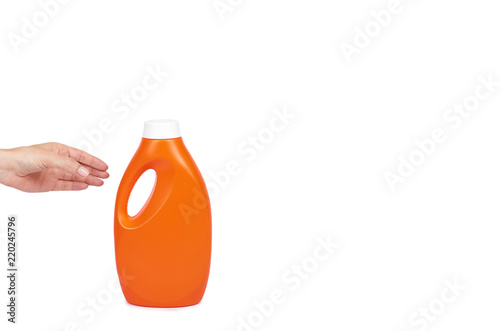 Orange plastic detergent bottle with hand isolated on white background, copy space template photo