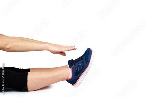 Fit female leg in sport shoe isolated on white background, copy space template