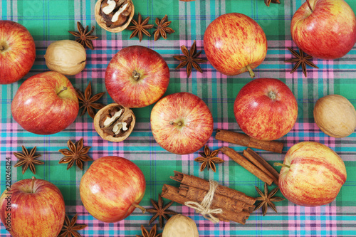 Bright ripe apples forming autumn mood background for design and decoration