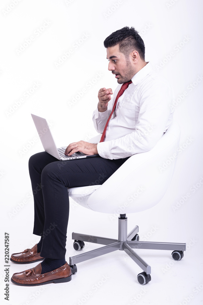 Businessman sitting on white chair isolated. Businessman sitting on white chair isolated.