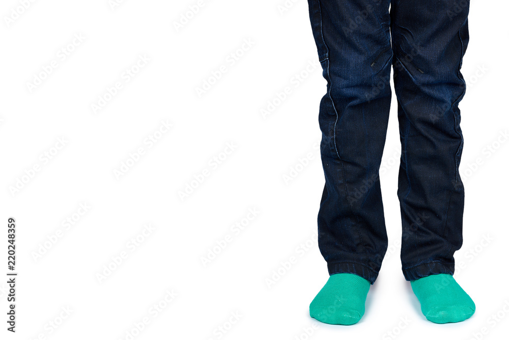 Kid legs in colored socks on leg isolated on white background, copy space template Kid legs in colored socks on leg isolated on white background, copy space template