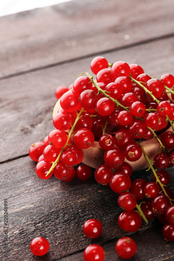 Fresh red currants on light rustic table. Healthy summer fruits Fresh red currants on light rustic table. Healthy summer fruits