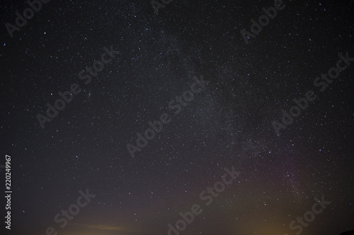 Shiny starry beautiful sky at night in Iceland. Northern light hunting. Natural astro background.