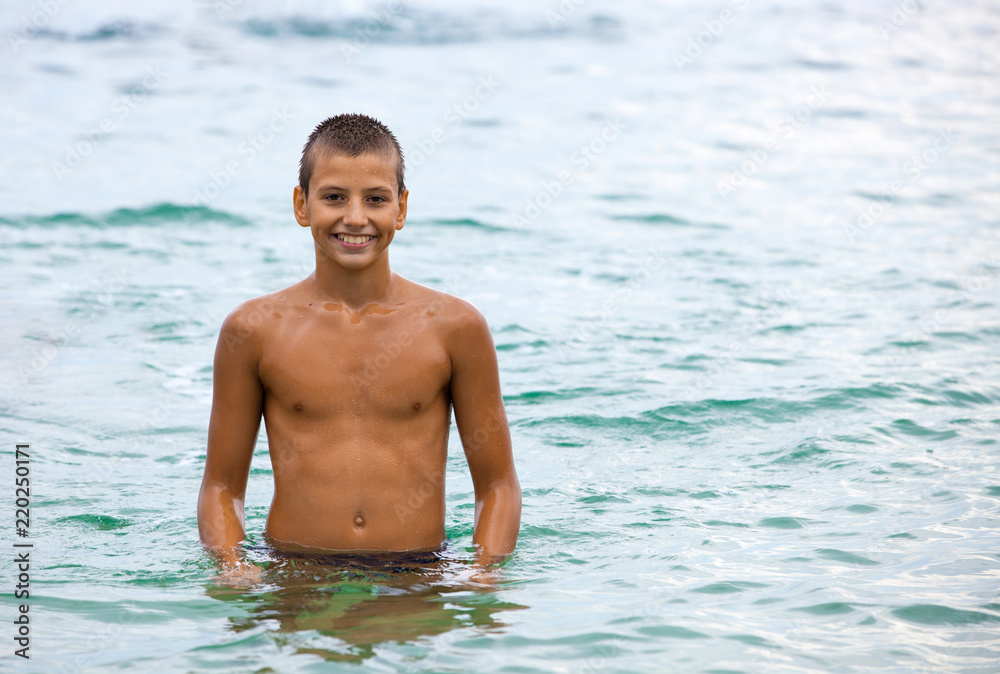 Cheerful boy on the beach