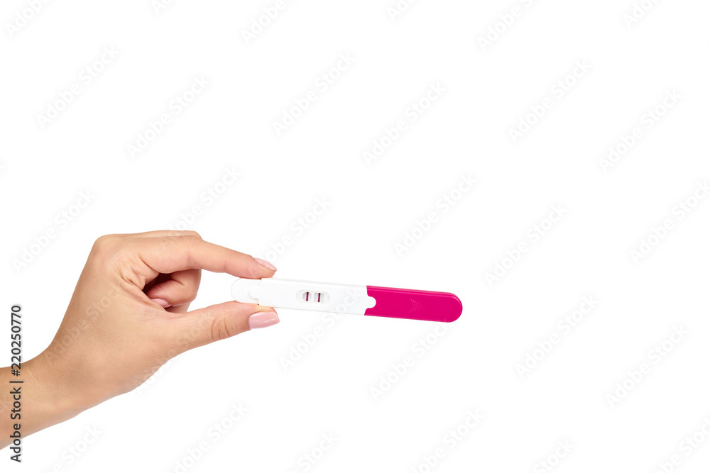 Positive pregnancy test with hand isolated on white background, two lines, copy space template. Positive pregnancy test with hand isolated on white background, two lines, copy space template.