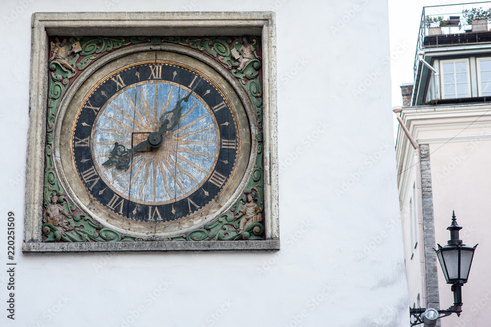 The white tower and old clock in the wall in old town of Tallinn Estonia Europe The white tower and old clock in the wall in old town of Tallinn Estonia Europe