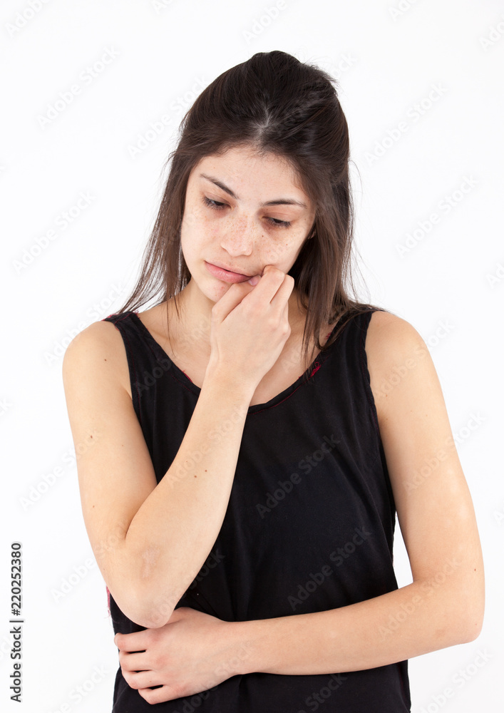Sad emotional girl on a light background Sad emotional girl on a light background